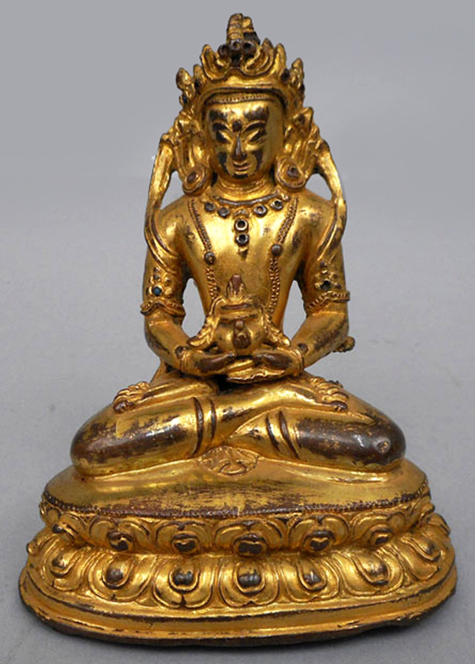 Dore bronze statue of Amitayus, Buddha of infinite life and infinite light, attrib. 15th century, Tibet. Est. $500-$800. Stephenson's Auctioneers image